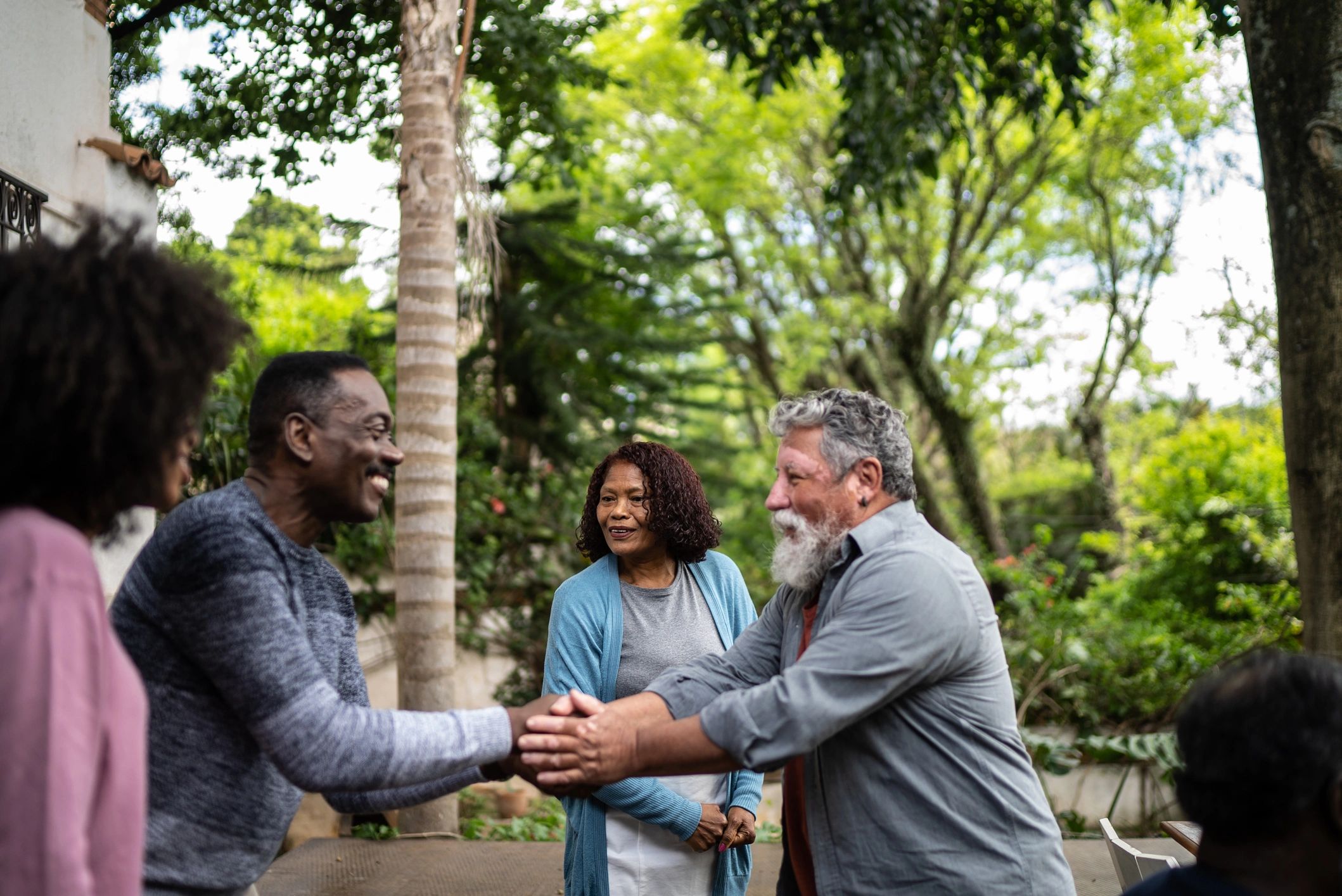 Neighbors greeting outside a home